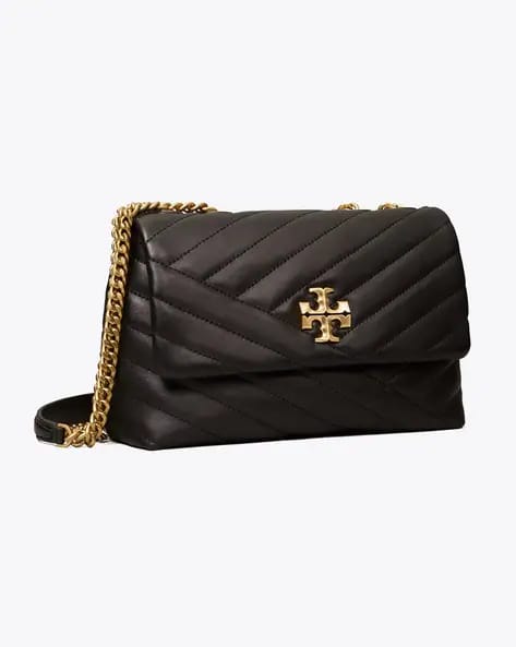 This is a brown quilted lambskin Chanel Classic 11.12 handbag featuring a gold-tone turnlock clasp.