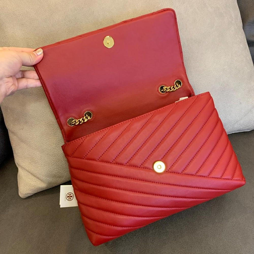 This is a brown quilted lambskin Chanel Classic 11.12 handbag featuring a gold-tone turnlock clasp.